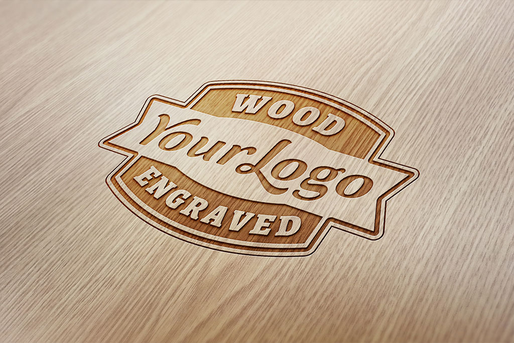 Maqueta de logotipo gratis de madera grabada