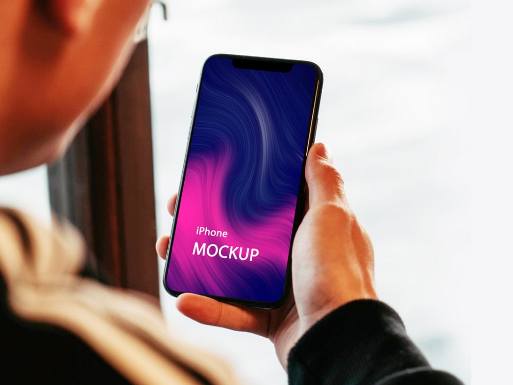Holding an iPhone Mockup