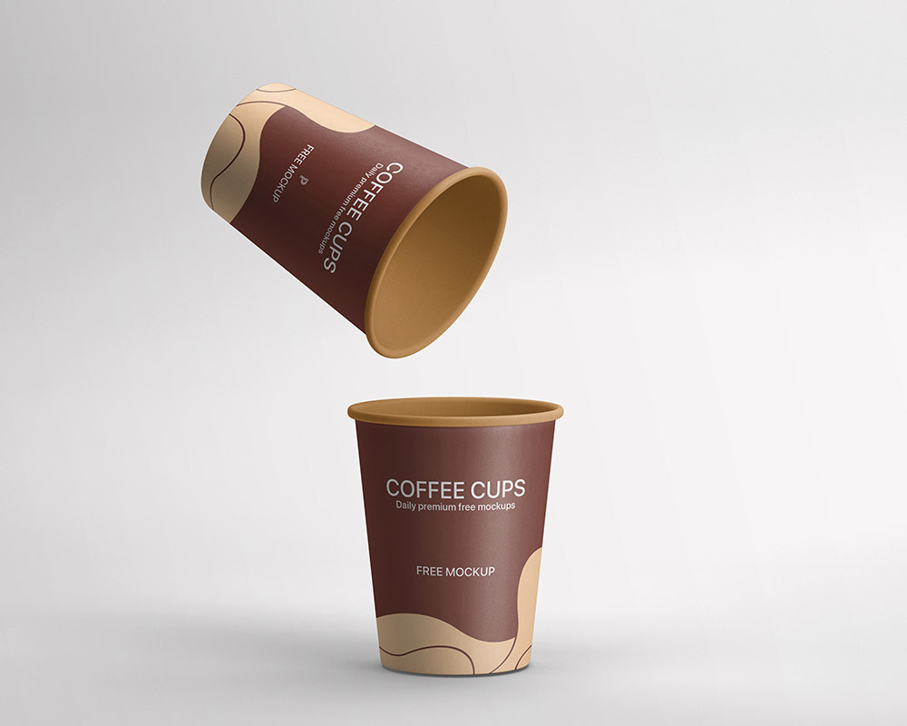 Бесплатные две бумажные кофейные чашки макета