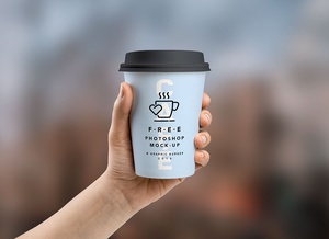 Coffee Paper Cup in Hand Mockup