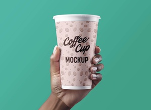 Hand Holding 20 oz Paper Coffee Cup Mockup