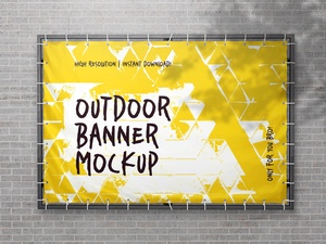 屋外広告の壁に取り付けられたバナーモックアップ
