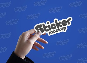 Female Hand Holding Sticker Mockup