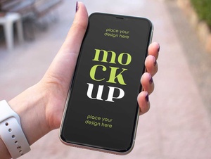 Hand Held iPhone Mockup Free Download • PSD Mockups